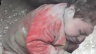 Syria amateur video shows toddler rescued from rubble in Aleppo